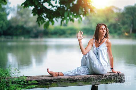 Woman Doing Yoga By A Lake Photograph By Microgen Images Science Photo Library Fine Art America