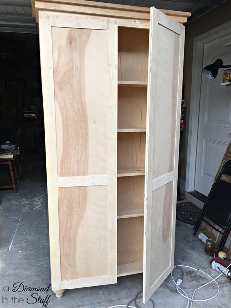 Large wooden storage cabinet with doors. DIY Aqua Storage Cabinet