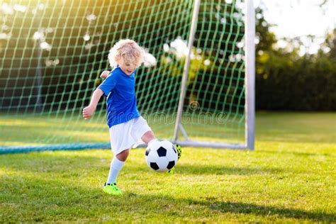 Kids Play Football Child At Soccer Field Stock Image Image Of