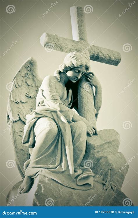 Grunge Image Of A Sad Angel Holding A Cross Stock Photo Image Of