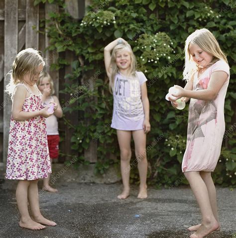 Girls Playing Together On Concrete Stock Image F Science