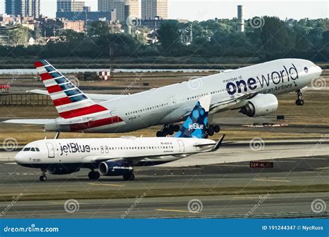 Jetblue Airbus A320 And American Airlines Boeing 777 Taking Off Behind
