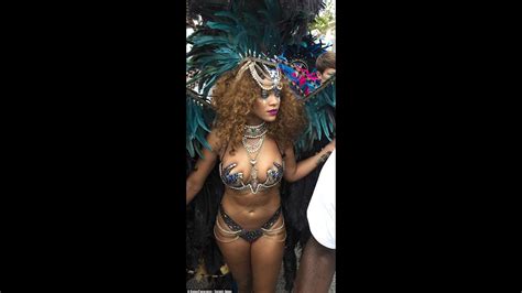 rihanna parades around in tiny sparkly bra and huge feather costume at barbados festival youtube