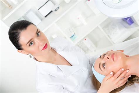 Female Beautician Doctor With Patient In Wellness Center Professional Cosmetologist Make