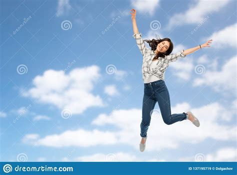 Happy Young Woman Or Teenage Girl Jumping Stock Image