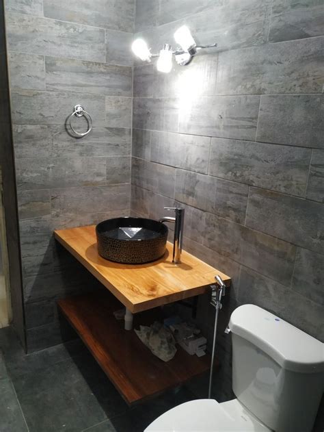 3.a sleek shower mirror if you don't play with bathroom mirrors that fog up. Minimalist styled bathroom with industrial toned grey ...