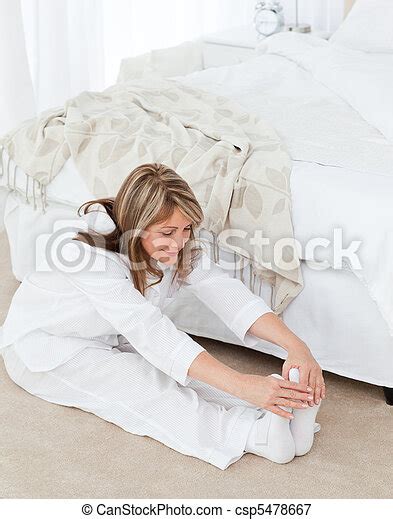 Mature Woman Doing Her Stretches At Home Canstock