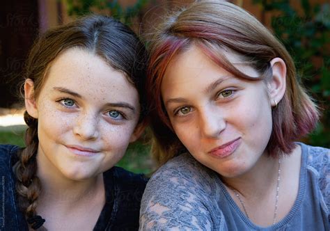 Close Up Of Two Smiling Tween Girl Friends By Tanya Constantine