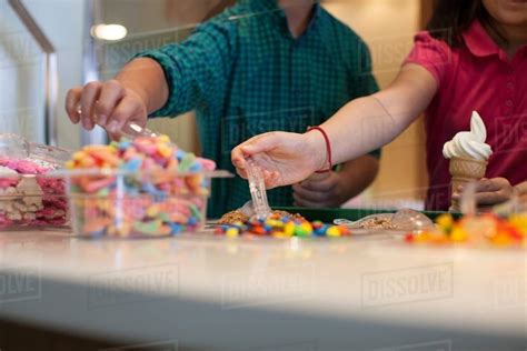 Children Choosing Toppings In Store Stock Photo Dissolve