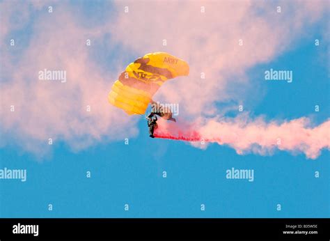 Skydiver And Parachute And Smoke Trail Stock Photo Alamy