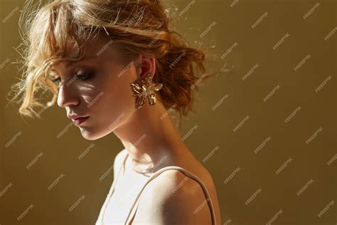 Premium Photo Earrings And Jewelry In Ear Of A Sexy Blonde Woman