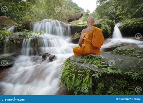 Buddha Monk Practice Meditation At Waterfall Editorial Photo
