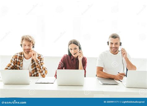 Happy Brokers In Headsets Working Near Stock Image Image Of Smile