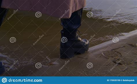 Close Up Of Woman Walking On Water In Shoes Stock Footage Stock Image