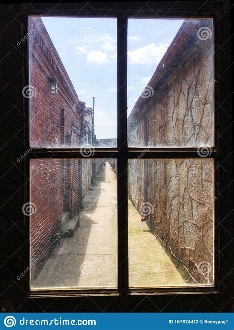 View Of An Alley Through The Window Of A Building Stock Photo Image