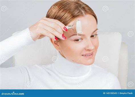 Face Massage Beautiful Woman Getting Massage Forehead Using Roller Massage Stock Image Image