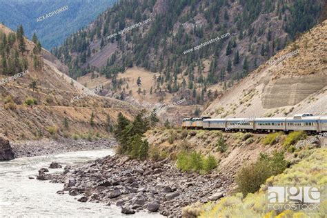 Passenger Train Travelling In The North Thompson River Canyon In