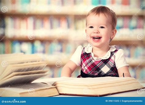 Happy Baby Girl Reading A Book In A Library Stock Image Image Of