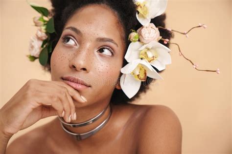 Portrait Of Half Naked African American Woman With Flowers In Her Hair