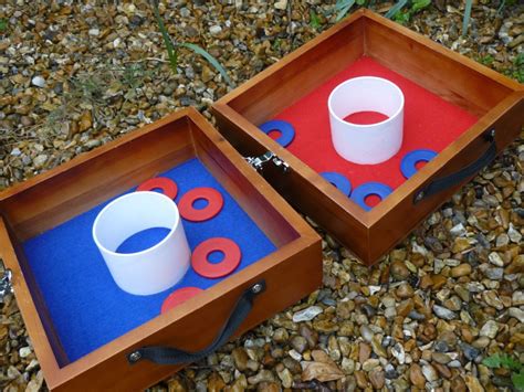 Each time both sets of washers (all 6) are tossed, the points scored for the target boxes are placed 20 feet apart. Washer Toss - Fete and Party Games Hire