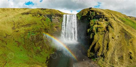 Famous Skogafoss Waterfall With A Rainbow Dramatic Scenery Of Iceland