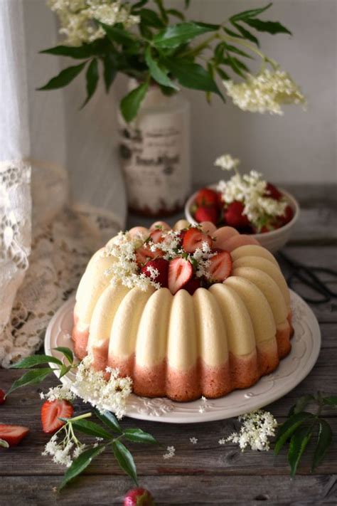 A White And Pink Bundt Wedding Cake With White Blooms And Fresh