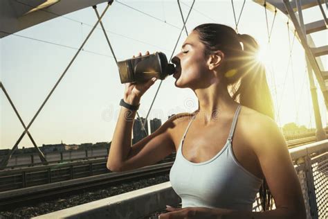 Woman Drinking Water From Bottle Muscular Young Female Taking A Break
