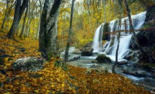 Beautiful Waterfall In Autumn Forest In Crimean Mountains At Sun Stock
