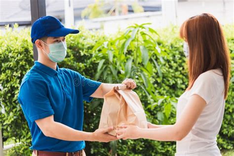 Delivery Express Courier Young Man Giving Paper Bags Fast Food To Woman