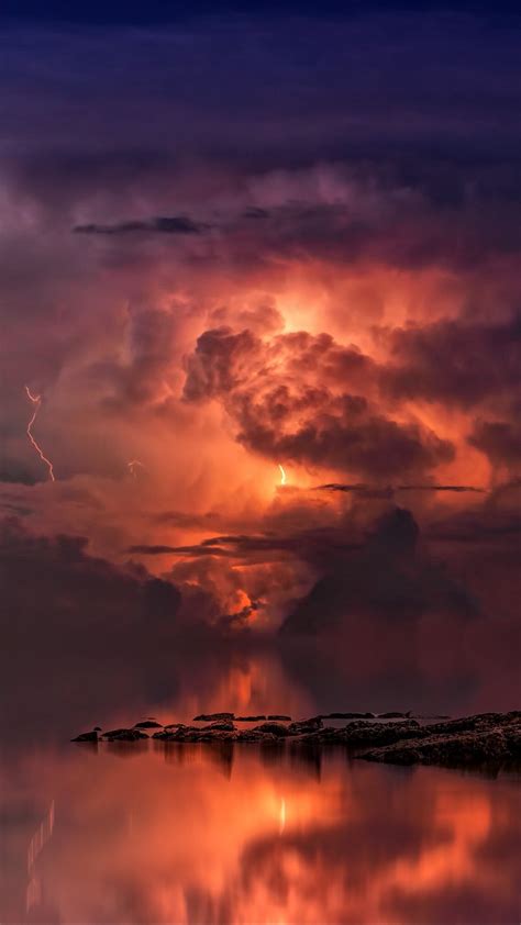 1080x1920 Wallpaper Thunderstorm Clouds Ocean Coast Twilight