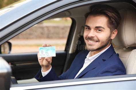 Young Man Holding Driving License Stock Image Image Of Card Road