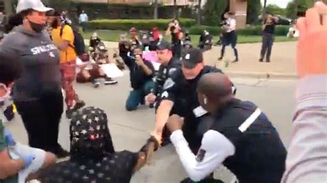 Police Officers Take A Knee With Protesters In Michigan Pix11