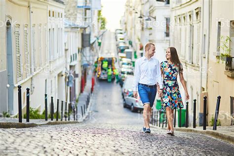 Young Romantic Couple Walking On Montmartre Stock Photo Download