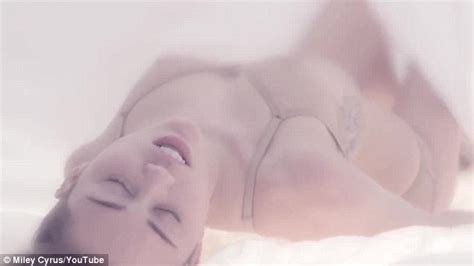 Miley Cyrus Wears Nude Lingerie While Suggestively Touching Herself In