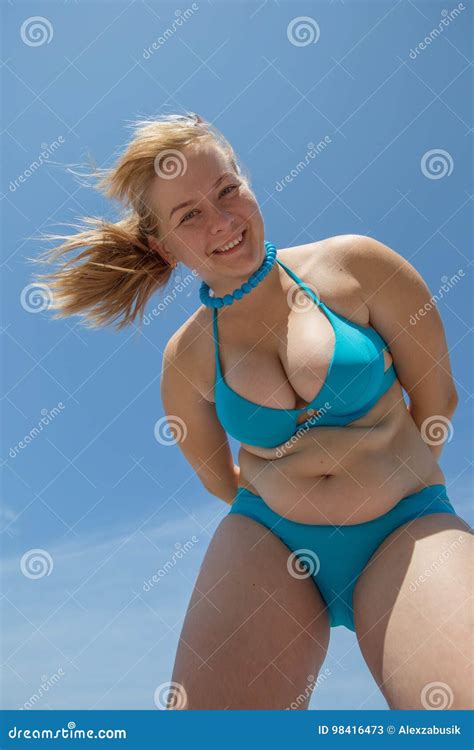 Overweight Woman In Blue Bikini Looks Down Stock Image Image Of Eastern Ethnicity 98416473