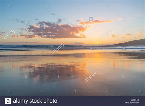 Reflection Sunset Over The Sea Sandfly Bay Dunedin Otago South Island New Zealand Stock