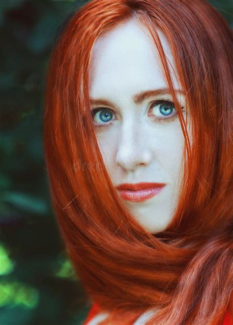 Beautiful Redhead Norwegian Girl With Big Eyes And Freckles On Face In The Forest Portrait Of