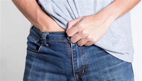 scientists explain why guys love to put their hands down their pants