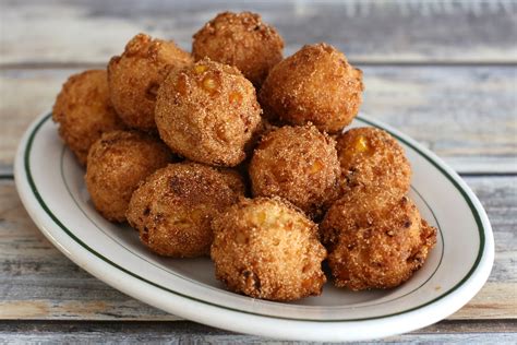 One to scoop up a rounded mound of dough and the other one to gently push it off with. Easy Hush Puppies With Cream-Style Corn