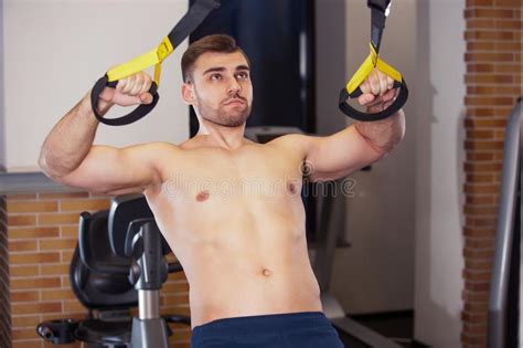 Handsome Muscular Bodybuilder Man Exercises With Battle
