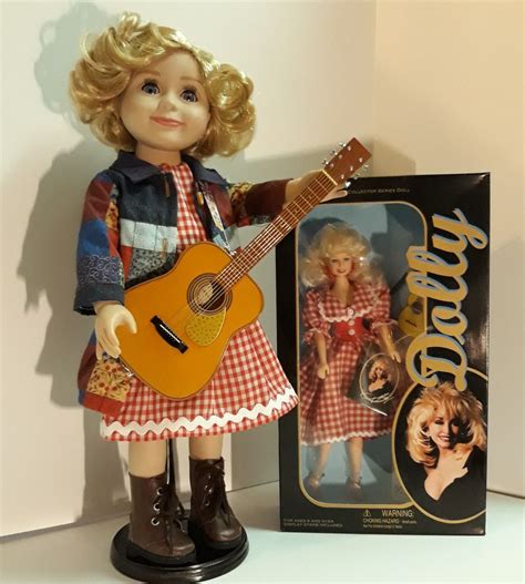 Little Dolly Parton Doll Wearing A One Of A Kind Heartsongs Dress With Her Coat Of Many