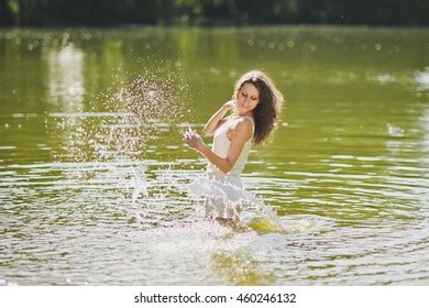 Girl Squirts Water Standing Waistdeep Lake Foto Stok Shutterstock
