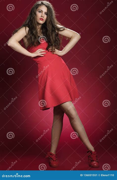 Sensual Beautiful Woman Posing In Red Dress Girl With Long Curly Hair Stock Image Image Of