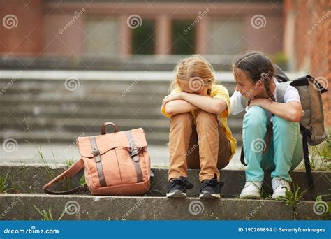 Friend Helping Sad Little Girl In School Stock Photo Image Of Friend