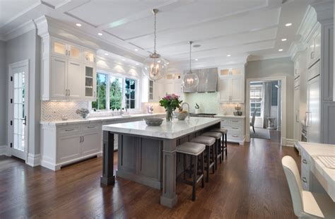 Tile floors are perfect for functional areas like a kitchen, a dark chocolate wood cabinetry surrounds white tile backsplash over dark tile flooring in this cozy kitchen. White Kitchen Cabinets with Gray Kitchen Island ...