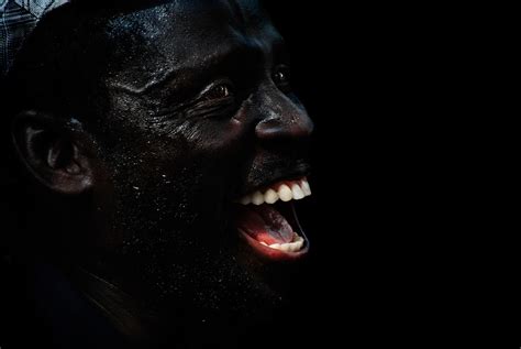 Black Man Smiling In The Dark