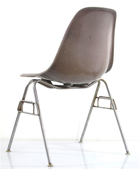 Black leather original still in good condition. Eames DSS chair 1954 vintage Herman Miller production