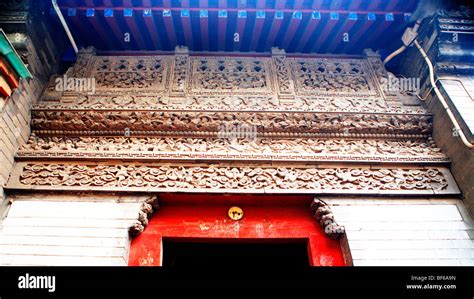 Main Gate Of A Hutong Mansion Decorated With Exquisite Brick Carvings