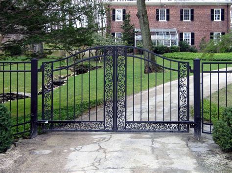 This Wrought Iron Entry Gate Features Both Streamlined Elements And