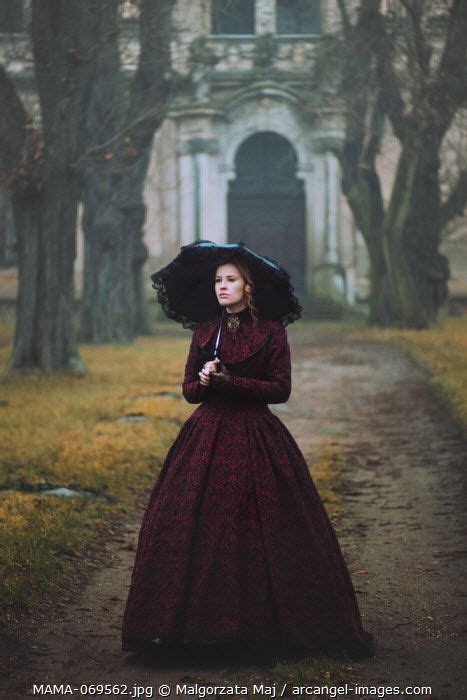 Victorian Woman In Dark Gown Holding Black